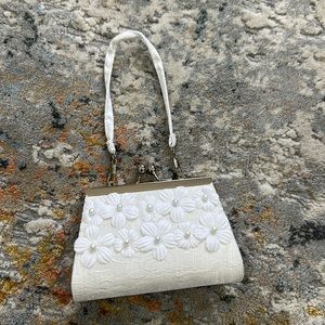 Little white purse with pearls from David’s Bridal